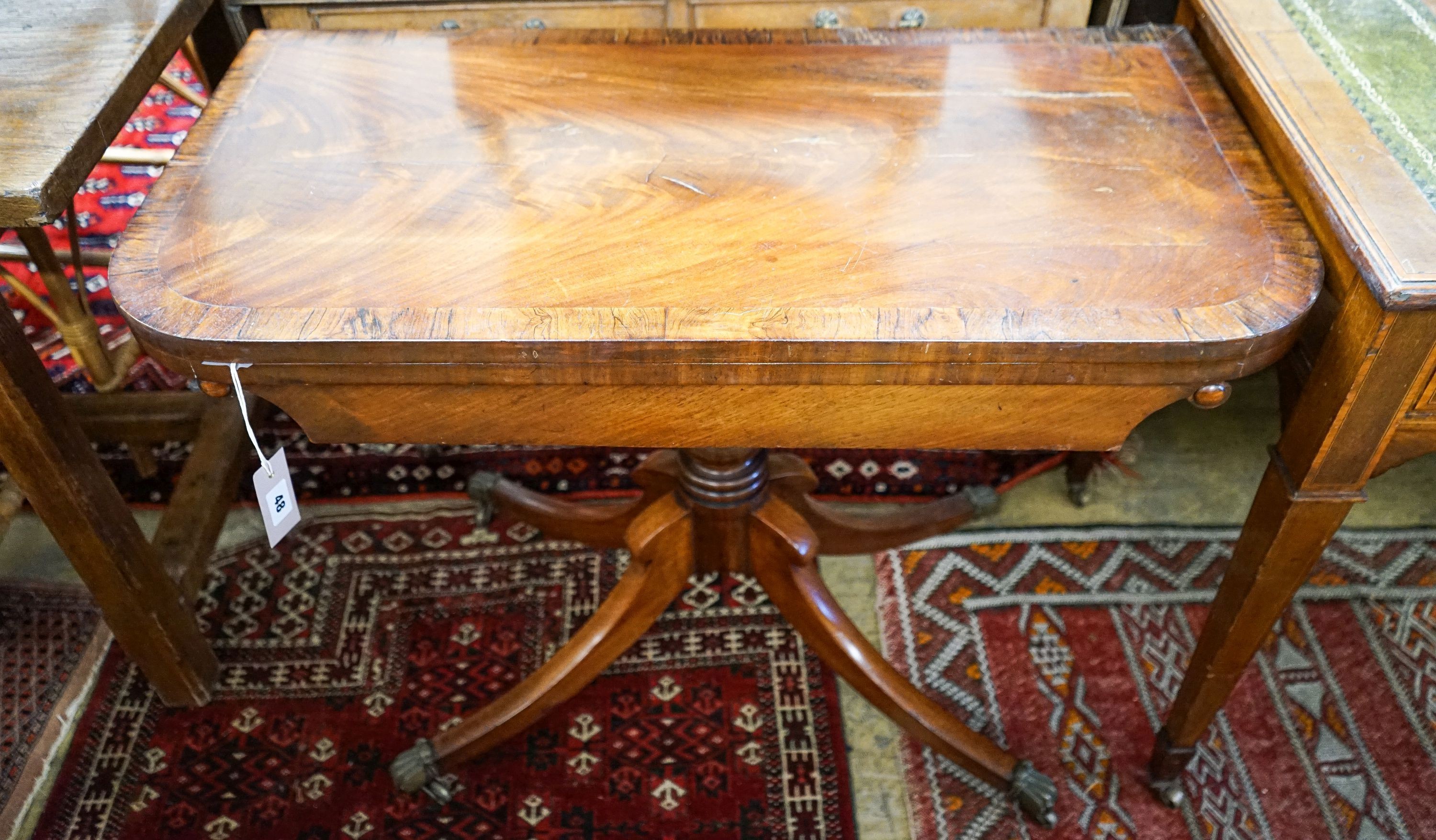 A late Regency mahogany banded folding card table, width 89cm, depth 44cm, height 70cm